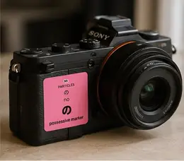 A の (no, possessive marker) particle sticker on a Sony mirrorless camera